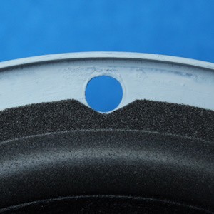 Cut the foam surround at the screw holes into the correct shape