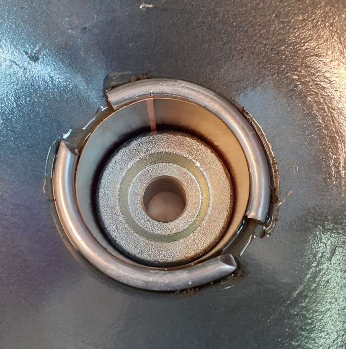 Pieces of metal hidden under the dustcap of the Infinity Kappa 100 woofer