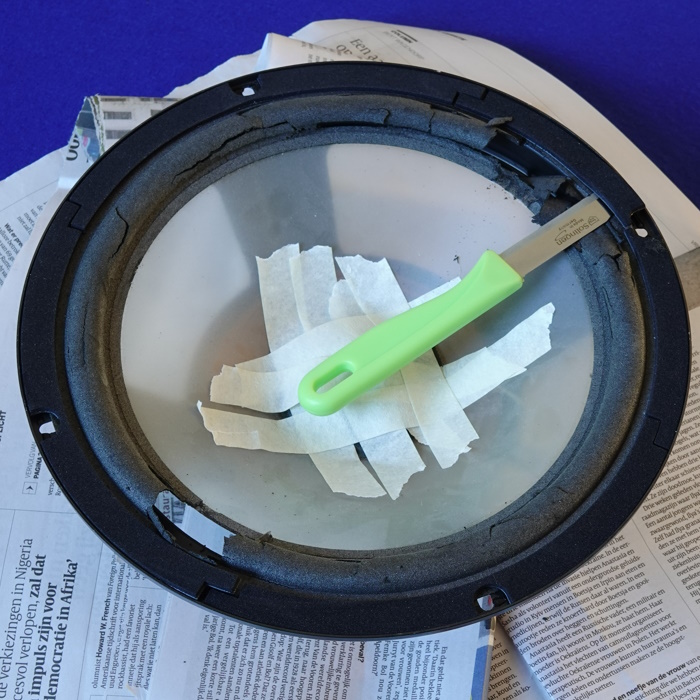 Re-foaming the woofer with spacers (shims): Tape off the hole in the dust cap to keep the air gap clean.