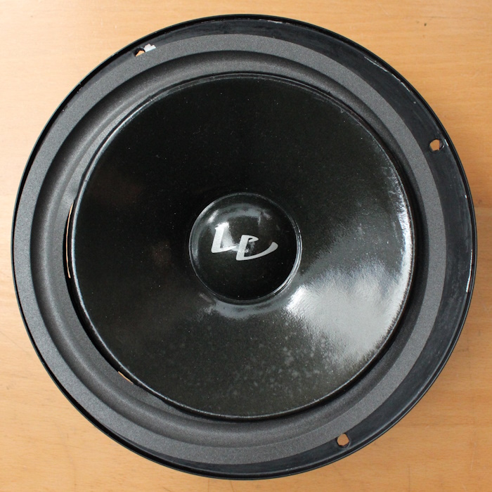 The foam surround is placed behind the woofer's cone