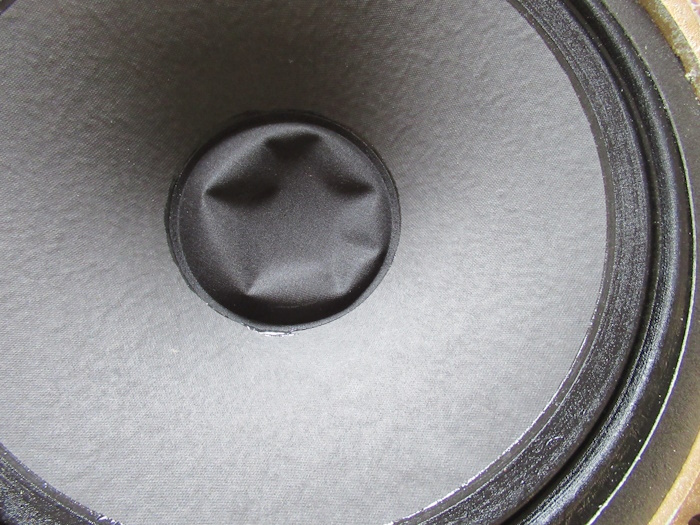 Woofer with a dented dust cap